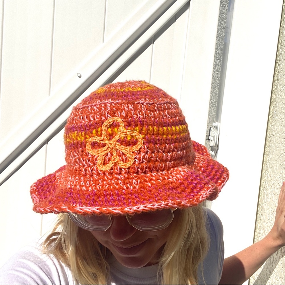 handmade crochet bucket hat with flower detail, adjustable size